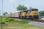 An eastbound freight approaches 14th St